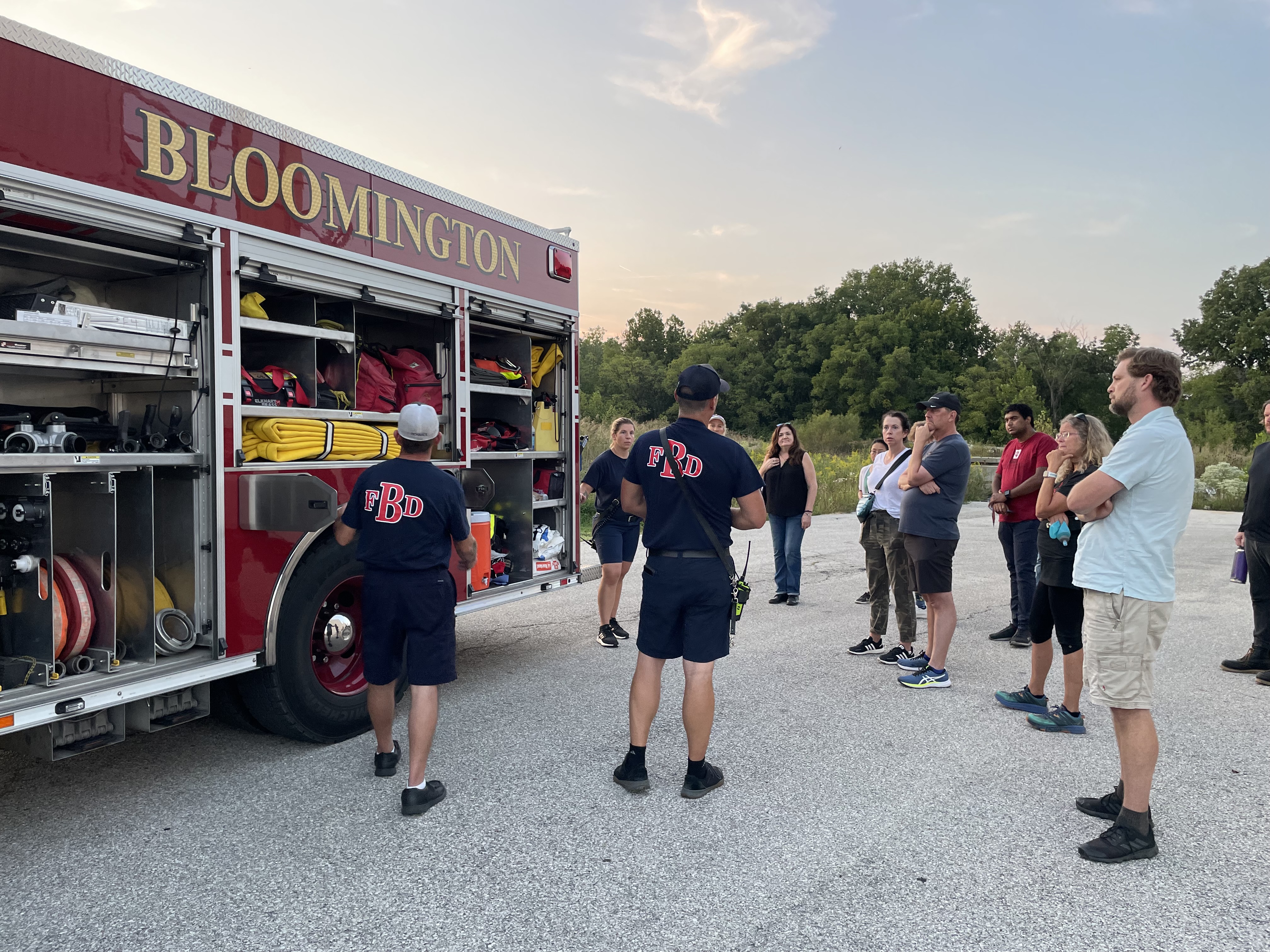 2022 Residents Academy Participants get an inside look at the equipment on a fire engine.