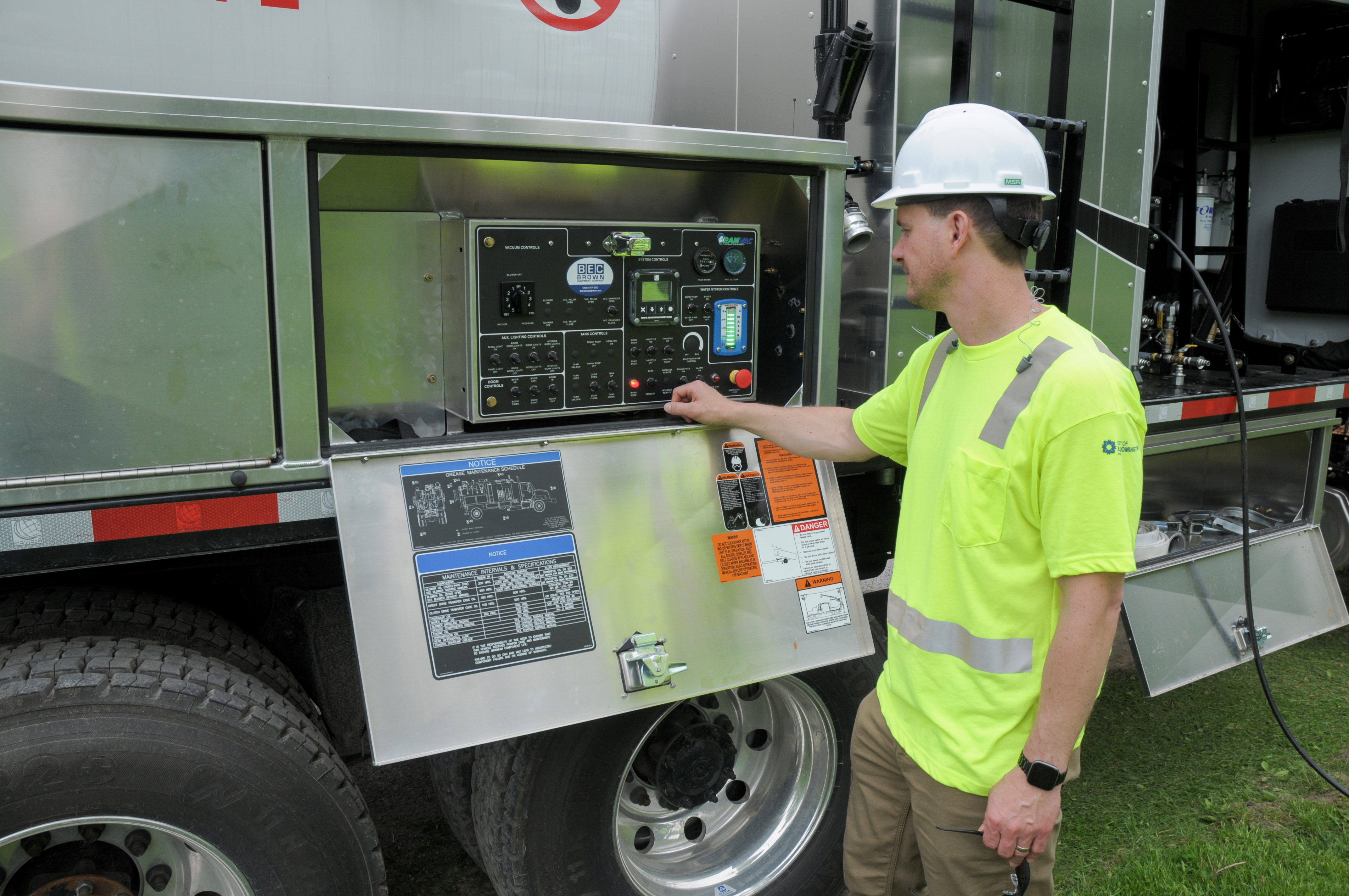 CBU employee reading screen on hydro excavator