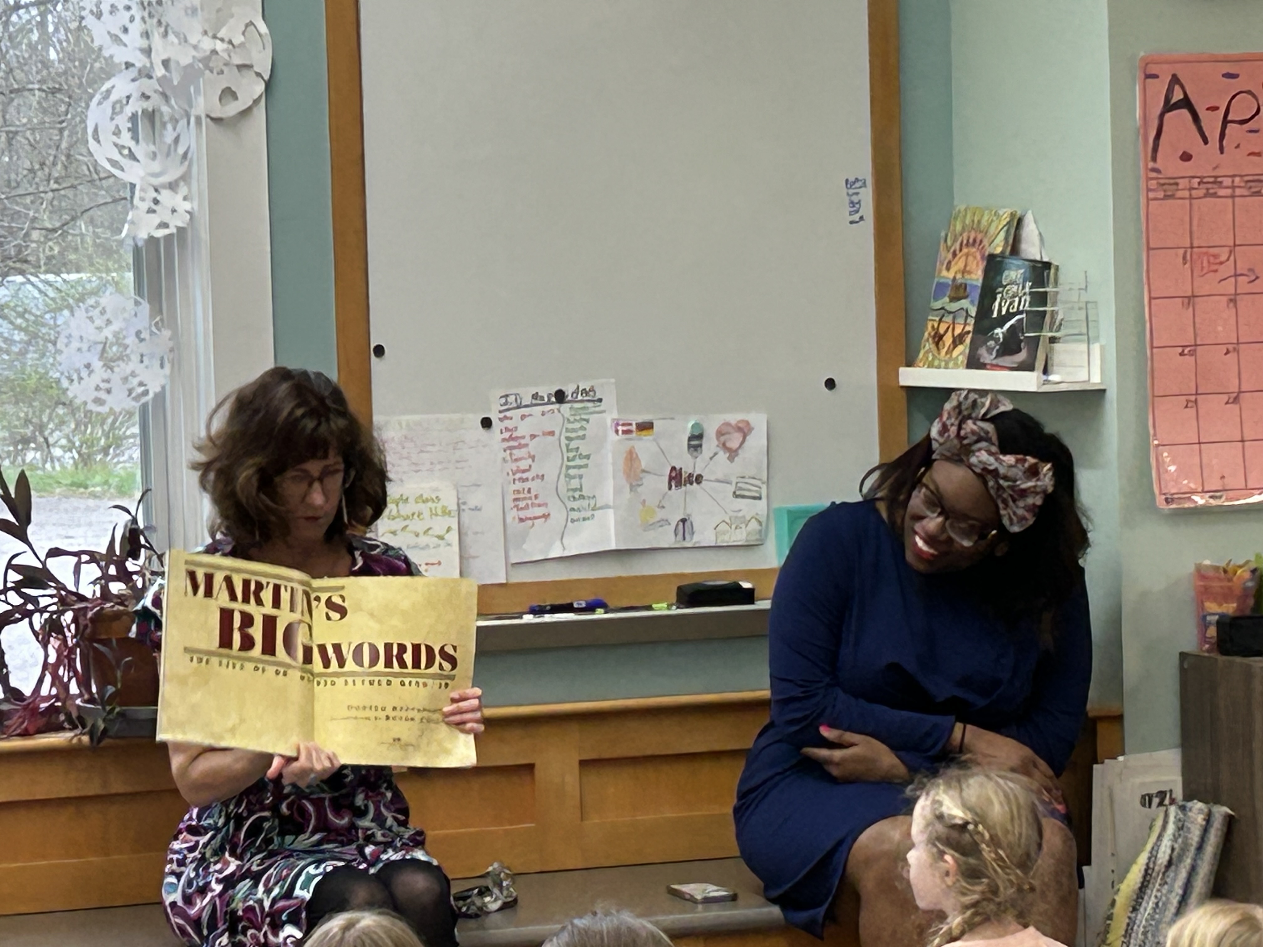 Julie Roberts reading to students with Gloria Howell