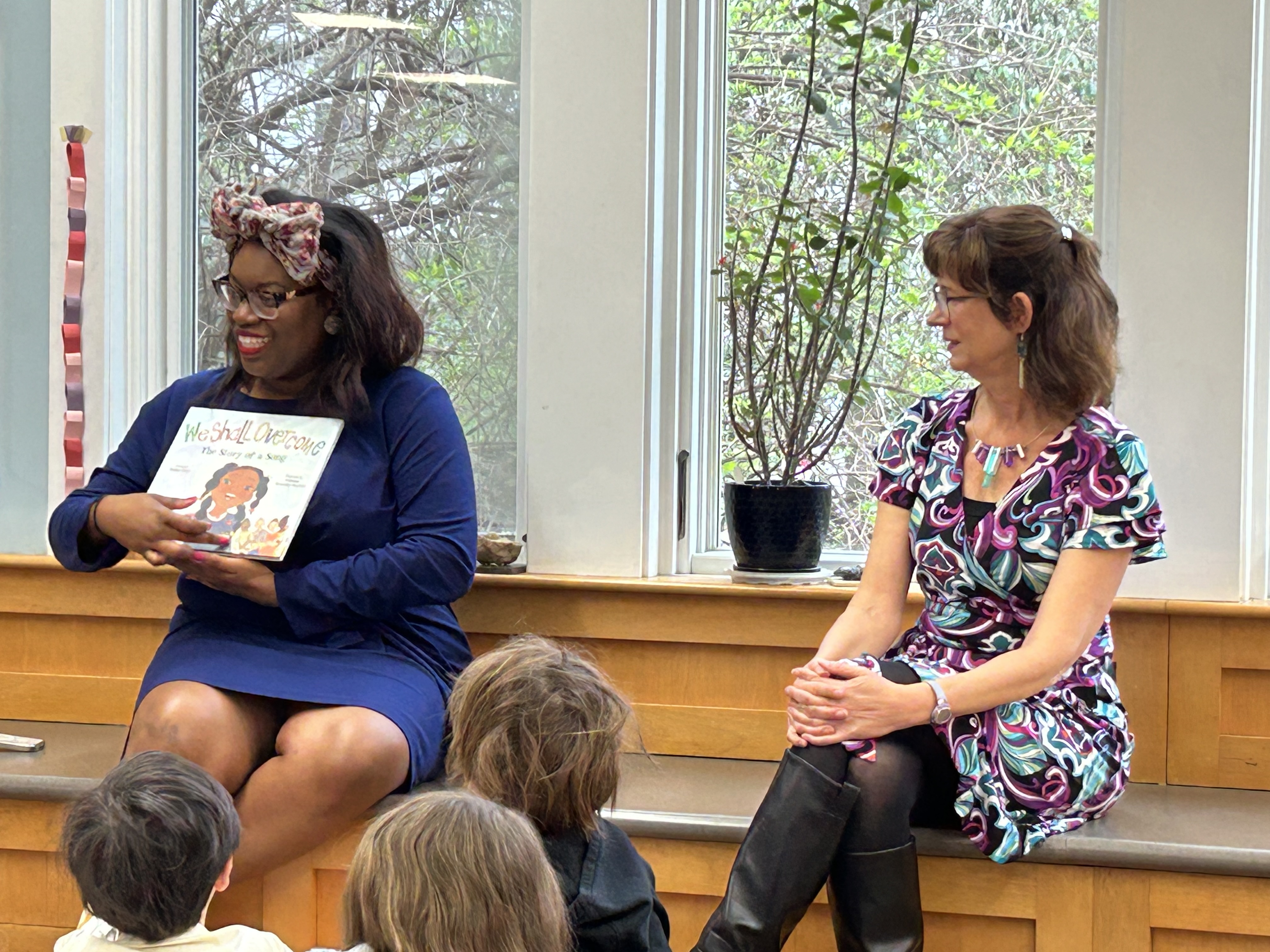 Gloria Howell and Julie Roberts reading to Montessori students