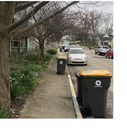 Trash and recycling bins blocking the sidewalk