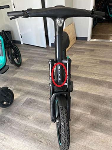 Photo of front of VeoRide Scooter with vehicle identification number circled in red