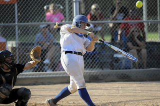 girl batter at the plate in a softball game
