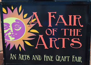 A Fair of the Arts logo on black background