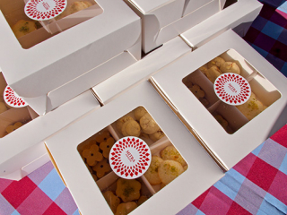 Market food and beverage artisan cookies in white boxes