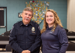 Chief of Police Mike Diekhoff and Senior Social Work in Police, Melissa Stone pose for a photo for Bloom Magazine