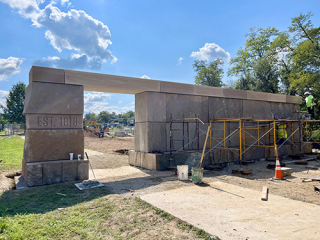 Bicentennial gateway being constructed of limestone blocks, with wires that will provide electric service for the backlighted "Bloomington" letters