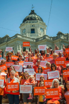 Group of Residents Wearing Orange Shirts at County Courthouse