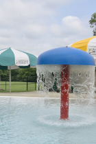 Mills Pool water feature and umbrellas.