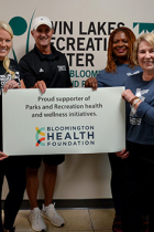Representatives of the Bloomington Health Foundation pose with Parks and Recreation staff at the Twin Lakes Recreation Center