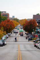 autumn scene of Kirkwood Ave looking west, cars, bikes, pedestrians
